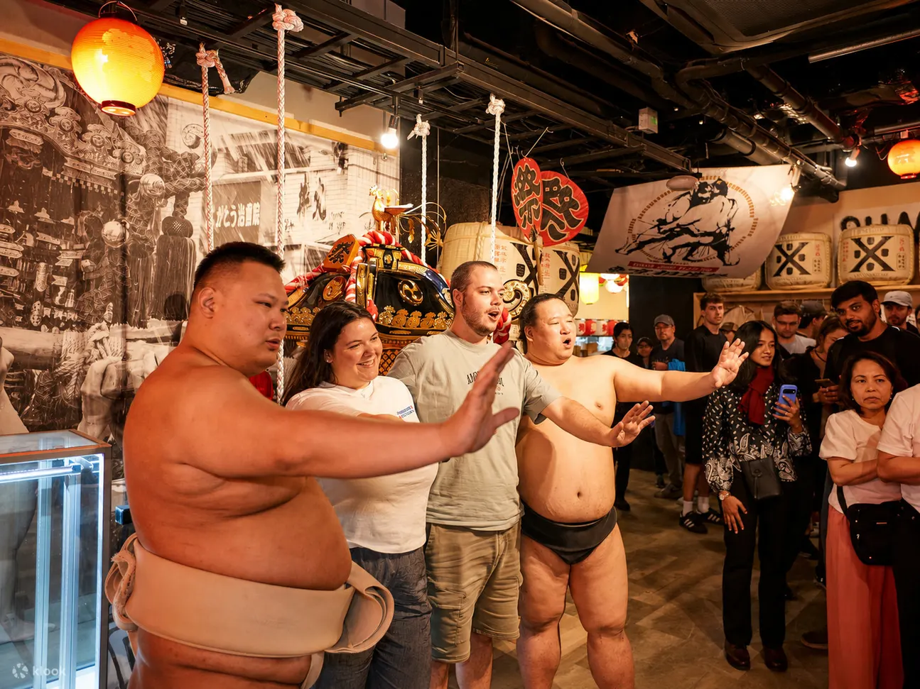 International guests enjoying Japanese festival culture with sumo wrestlers